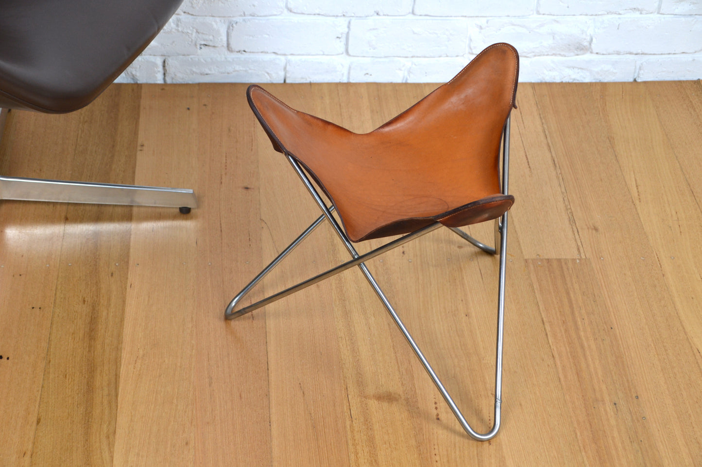 Vintage tan leather butterfly stool / footstool