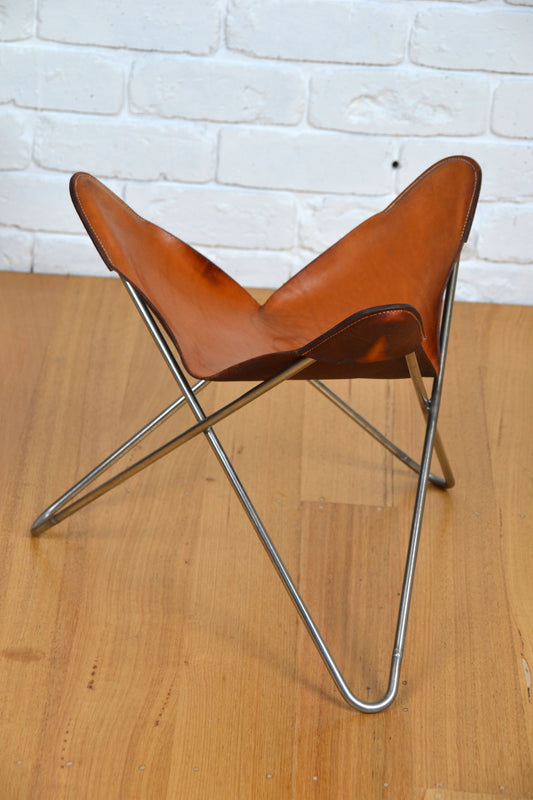 Vintage tan leather butterfly stool / footstool