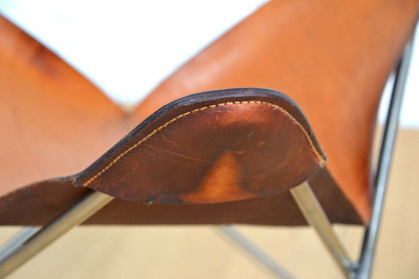 Vintage tan leather butterfly stool / footstool