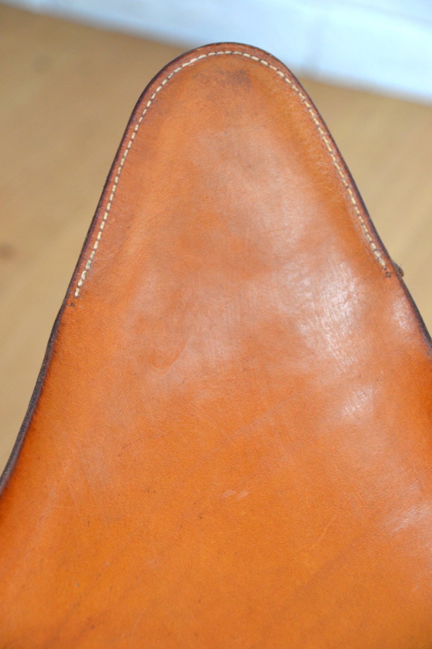 Vintage tan leather butterfly stool / footstool