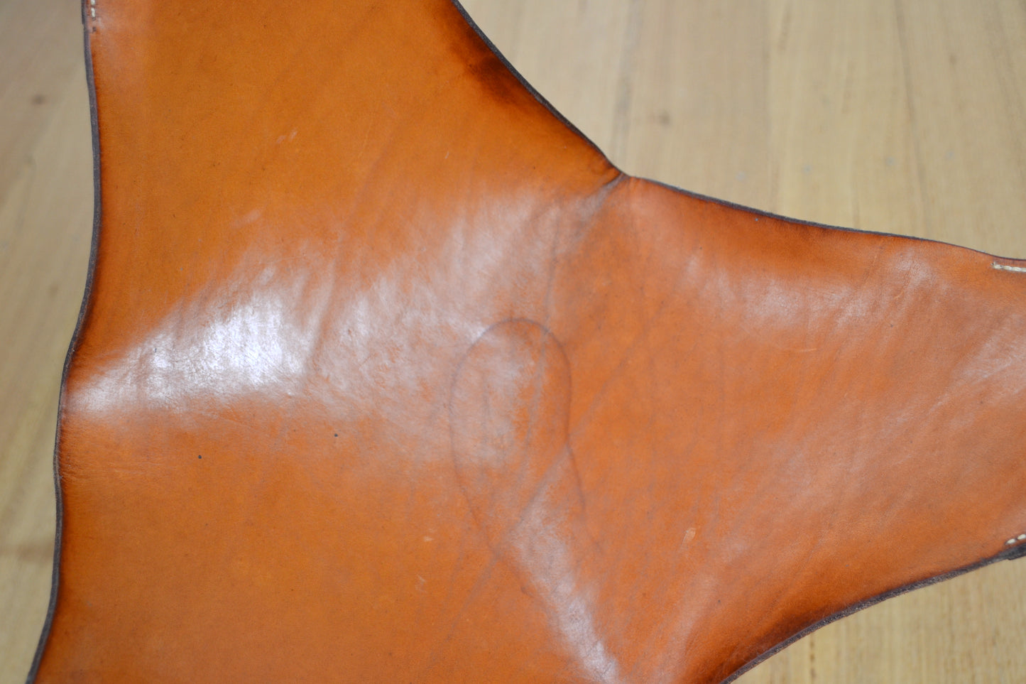 Vintage tan leather butterfly stool / footstool