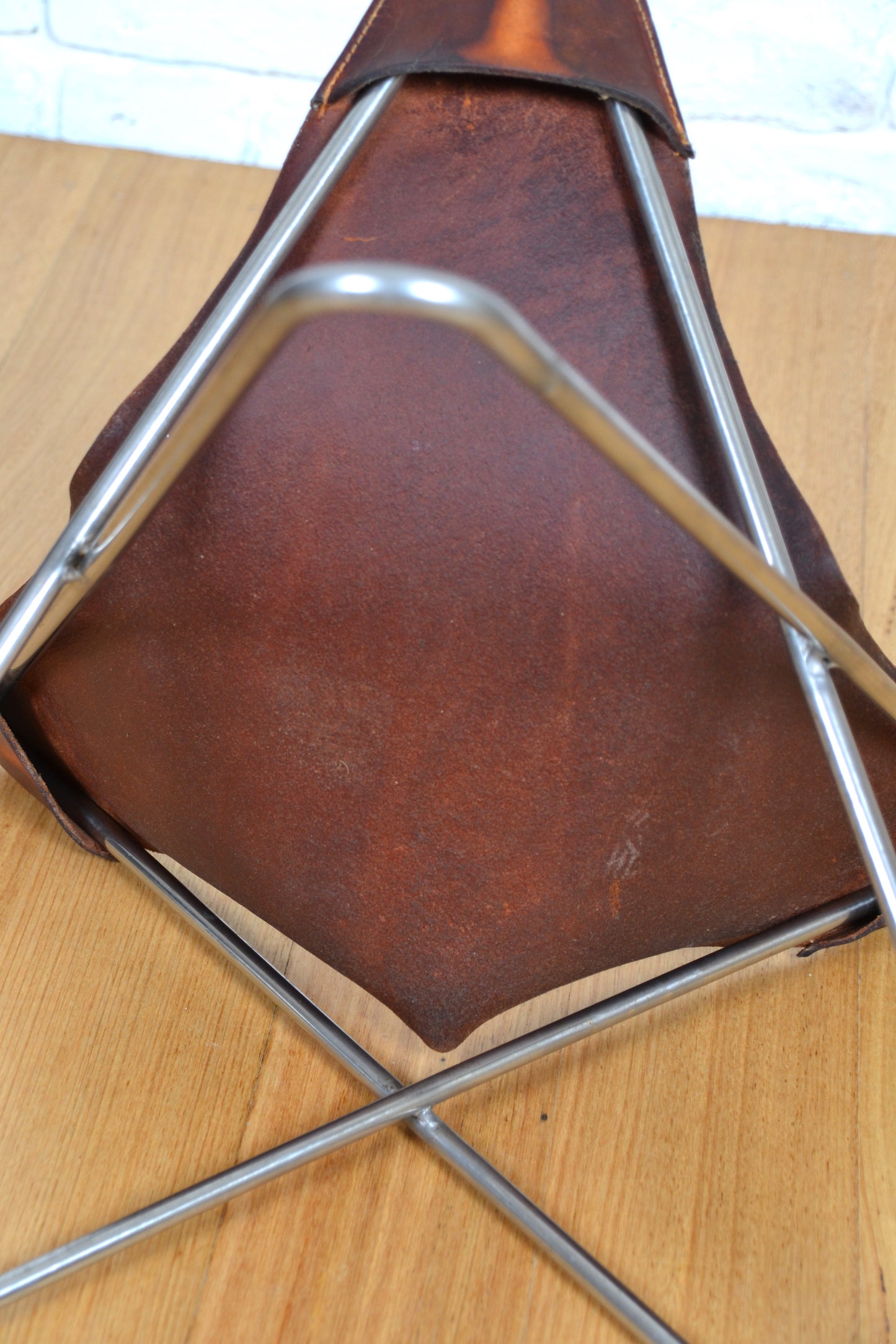 Vintage tan leather butterfly stool / footstool