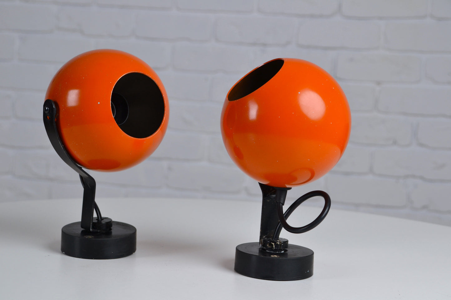 Pair eyeball space age wall sconces / lights in orange by Erco - Germany