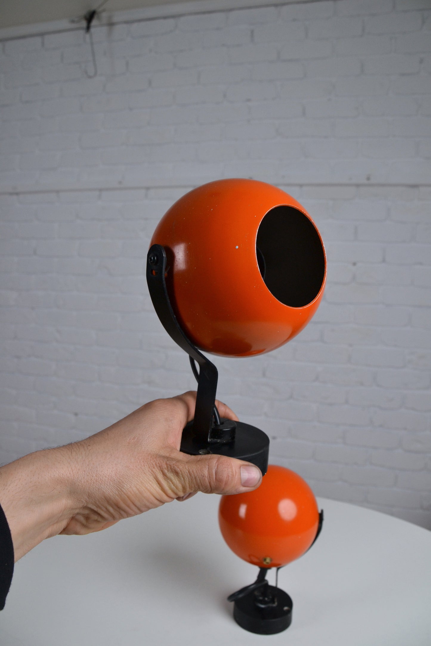 Pair eyeball space age wall sconces / lights in orange by Erco - Germany